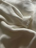 Folded knitwear — photo by Veronika Kuracheva on Pexels