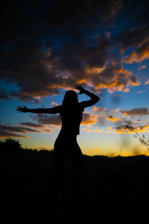 Free Silhouette Of Woman During Sunset Stock Photo