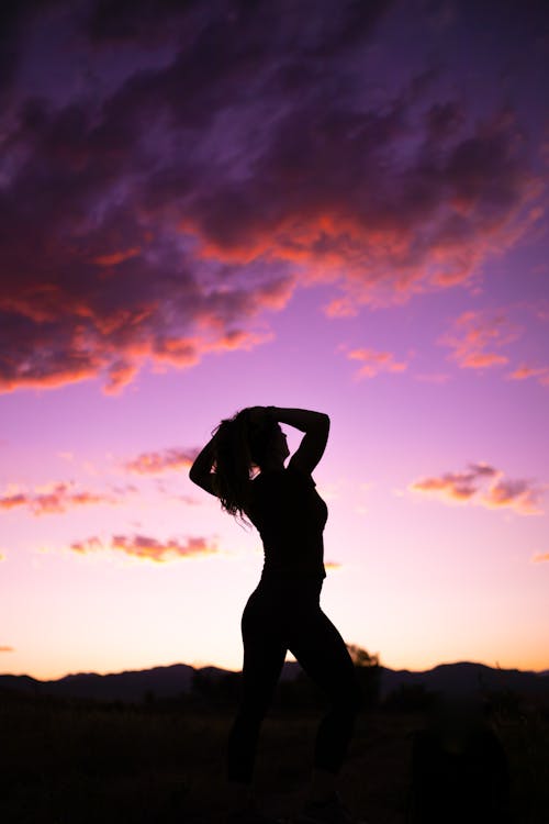 Silhouette Of Woman During Sunset