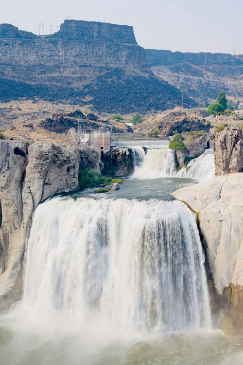 Free Breathtaking view of Shoshone Falls surrounded by rocky cliffs under a clear sky. Stock Photo