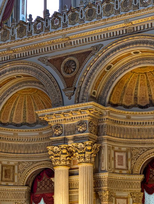 Free Close-up of an ornate architectural design featuring intricately carved columns and arches. Stock Photo