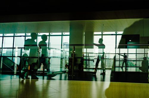 Free Artistic silhouettes reflected inside a modern building in Jakarta, Indonesia. Stock Photo