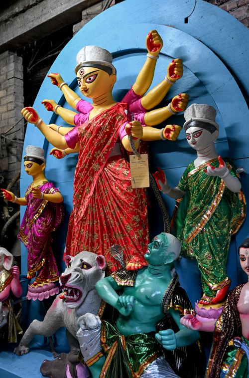 Free Colorful clay Durga idols showcased in Kolkata's iconic Kumartuli workshop. Stock Photo