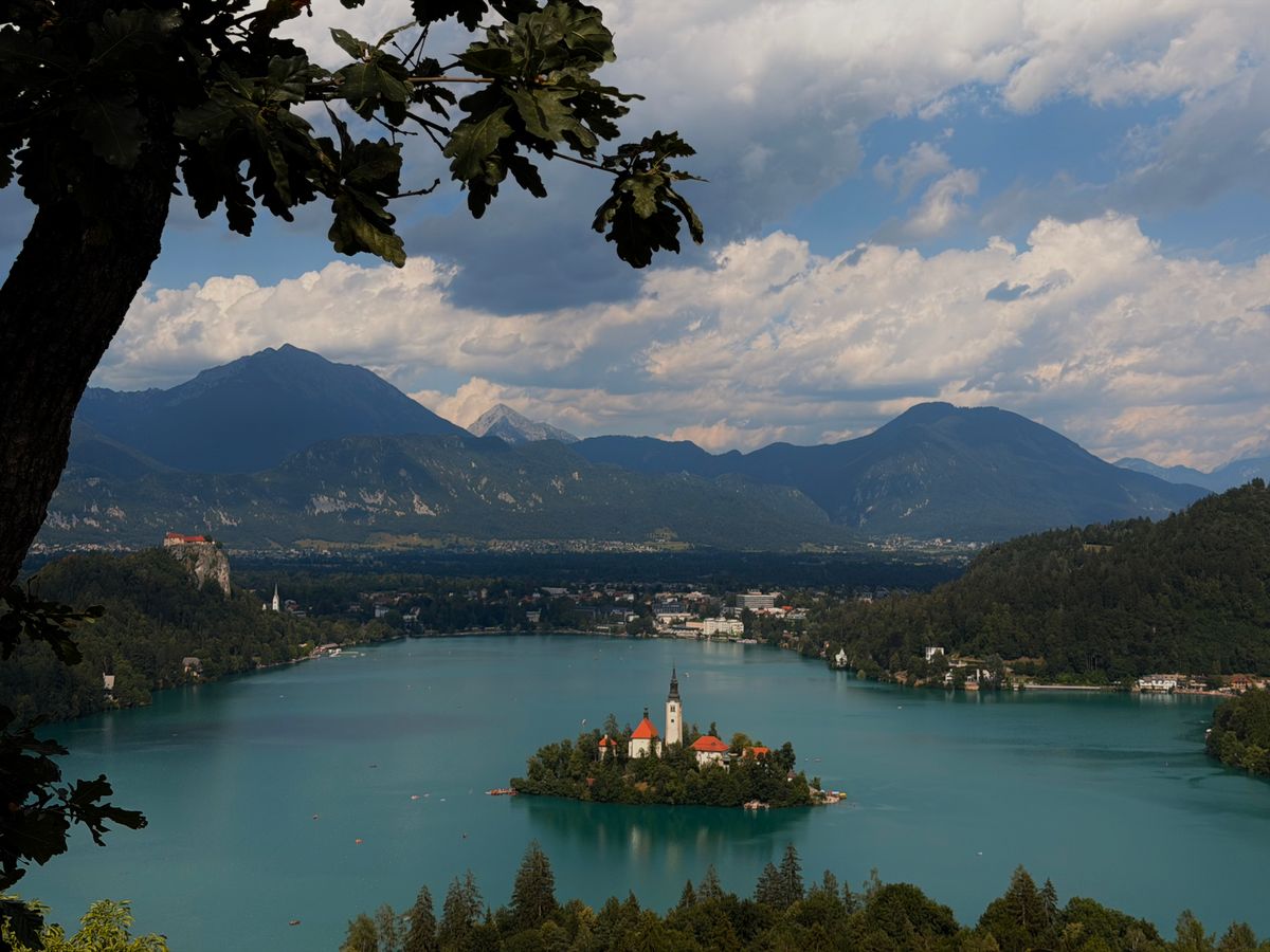 Bled Island church on Lake Bled framed by the Julian Alps