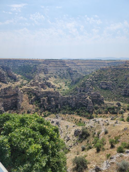 Free A breathtaking view of a vast canyon landscape in Uşak, Türkiye, showcasing dramatic geological formations. Stock Photo
