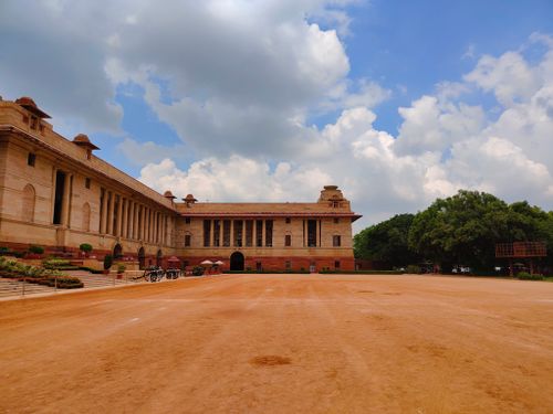 Free A view of Rashtrapati Bhavan, Delhi, featuring vibrant architecture and a vivid sky. Stock Photo