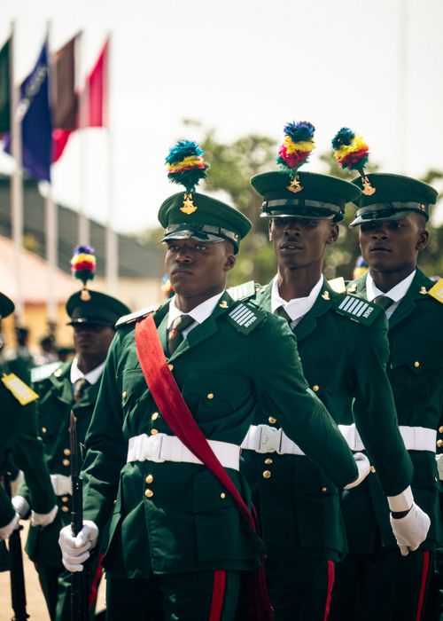 Free Soldiers in formal uniforms at a daytime military parade, displaying discipline. Stock Photo