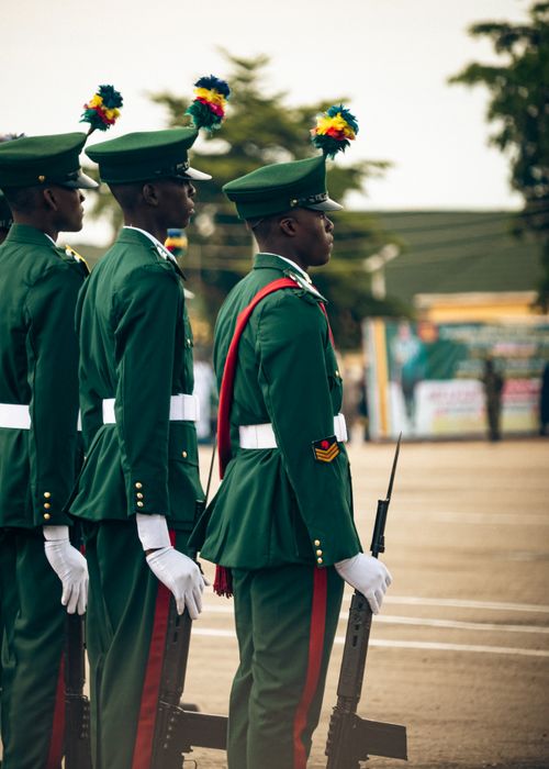 Free Soldiers in green uniforms participate in a formal military parade outdoors. Stock Photo