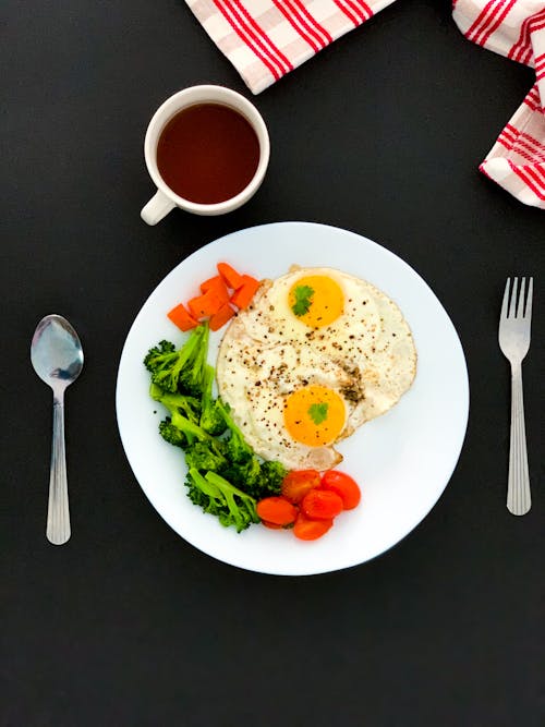 Egg And Vegetable On White Ceramic Plate