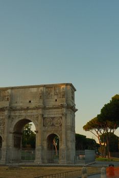 Captivating view of the Arch of Constantine with clear skies in Rome, Italy.