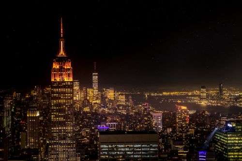 Free A beautiful nighttime view of New York City's iconic skyline featuring the Empire State Building. Stock Photo