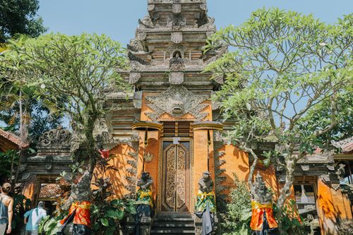 Free Beautifully ornate entrance to a traditional Balinese temple in Ubud, surrounded by lush greenery. Stock Photo