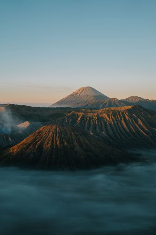 Free Breathtaking aerial photograph of Mount Bromo at sunrise, showcasing Indonesia's stunning landscapes. Stock Photo
