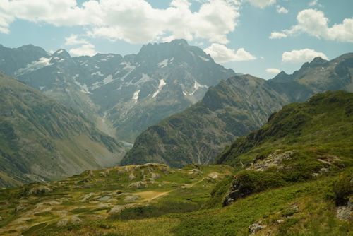 Free Breathtaking view of the French Alps in summer with snow-capped peaks and lush greenery. Stock Photo