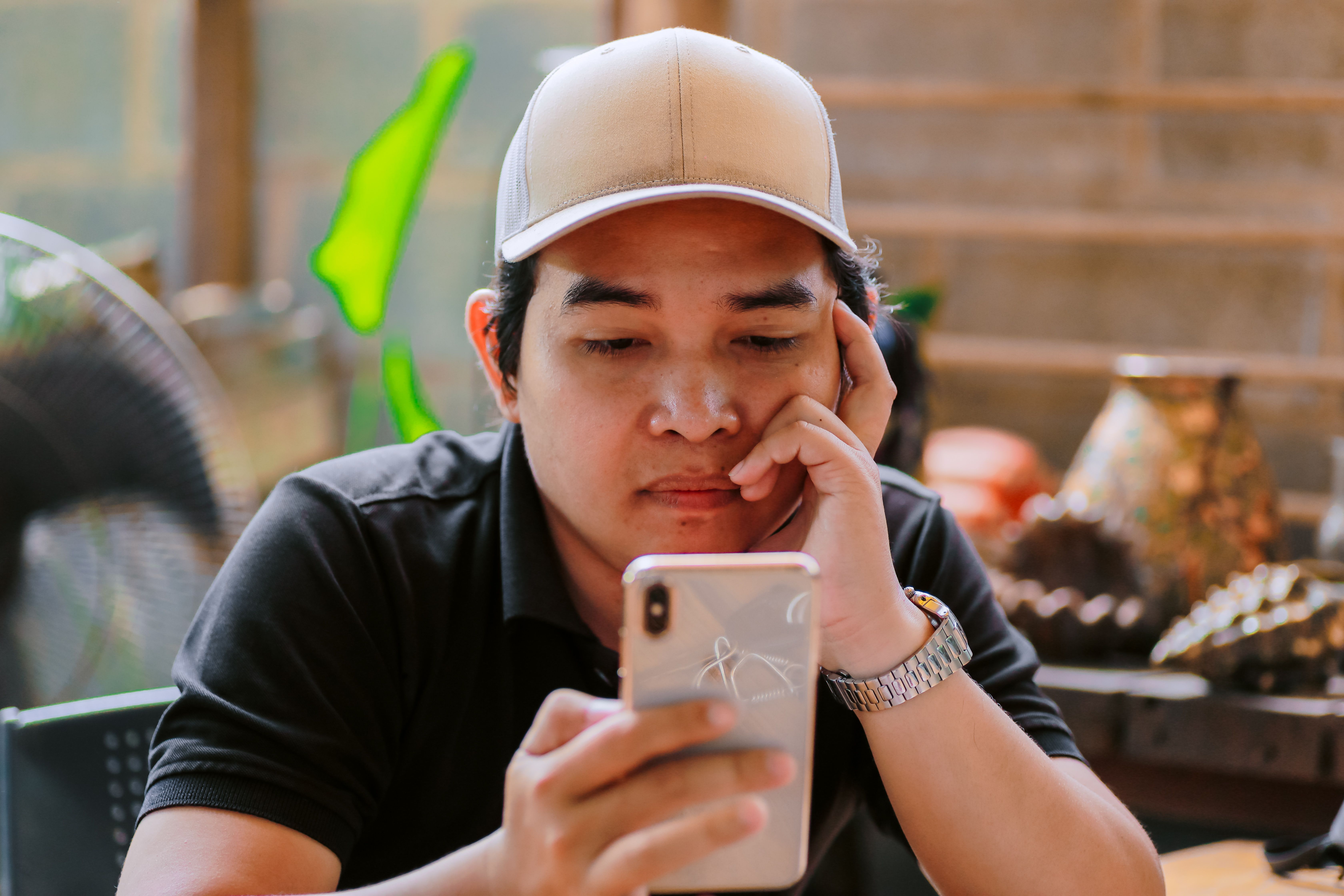 concerned Thai user reviewing failed withdrawal messages on a laptop beside bank transaction records