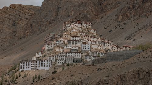 Free View of Key Monastery nestled on a hill in Spiti Valley, India, showcasing Buddhist architecture. Stock Photo