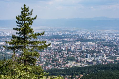 Free Expansive aerial view over Sofia city from Vitosha Mountain with lush greenery and distant cityscape. Stock Photo