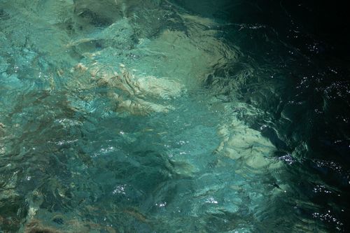 Free Turquoise water reflecting light in Sapadere Canyon, a beautiful natural scene in Antalya, Turkey. Stock Photo