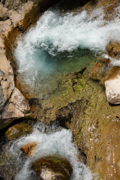 Free Captivating view of a rushing stream over textured rocks in Sapadere, Antalya, Türkiye. Stock Photo