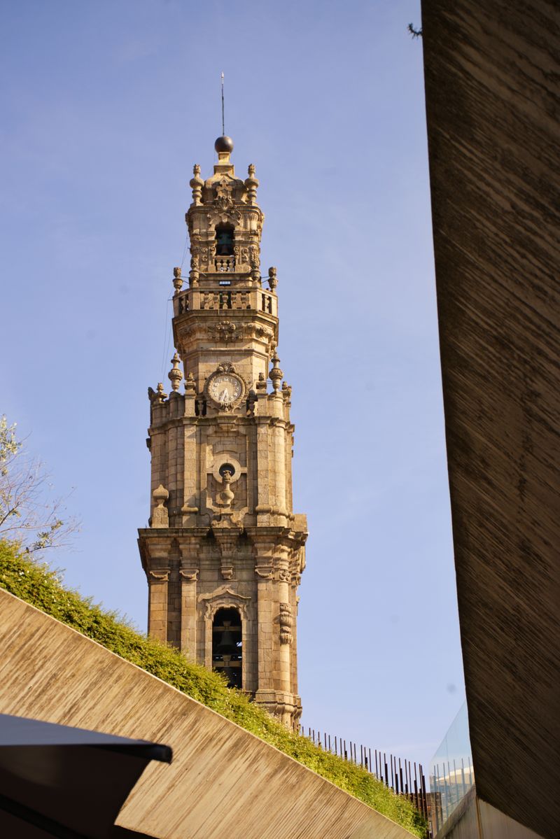 Baroque bell tower of the Clérigos Church in Porto against a clear sky