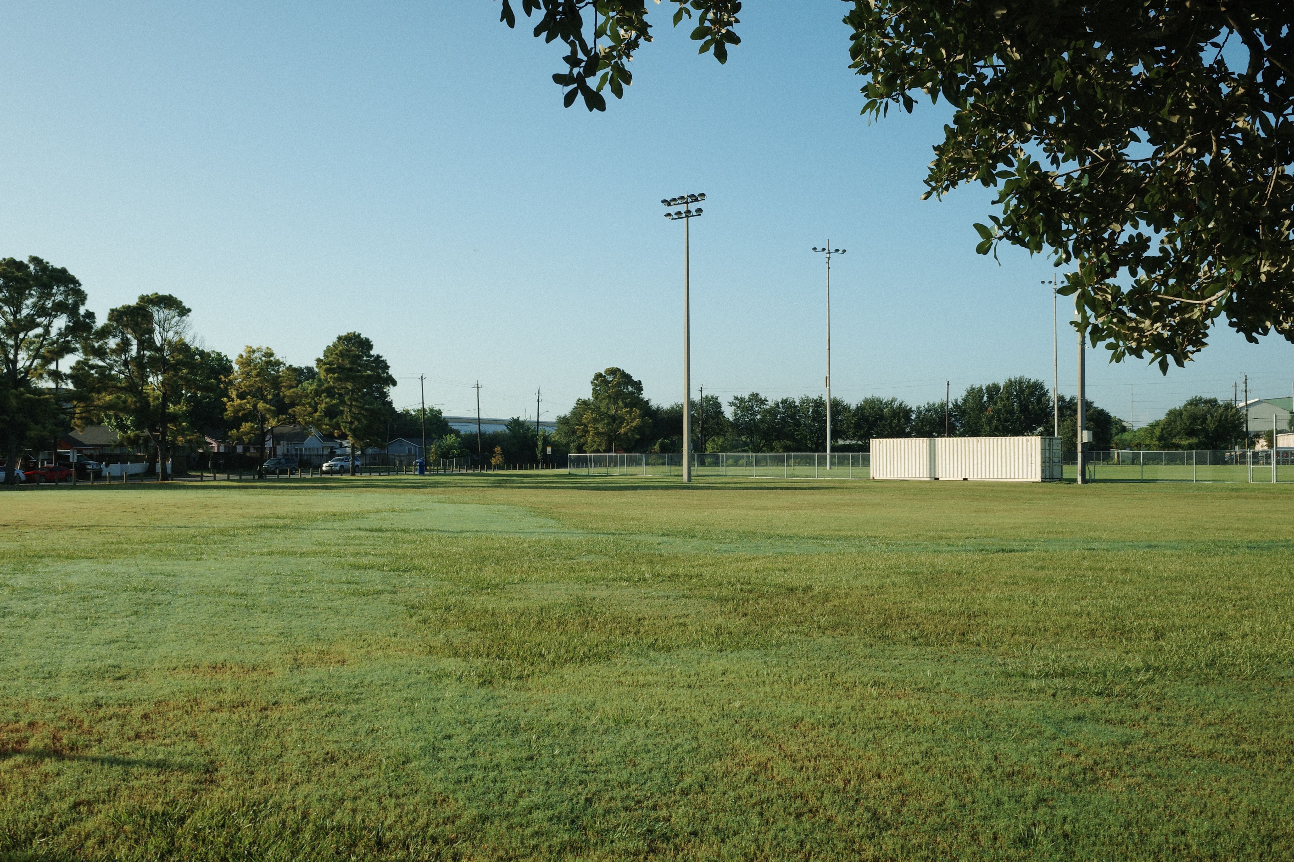 Well-maintained grass playing fields at the Ultimate Athletic Complex