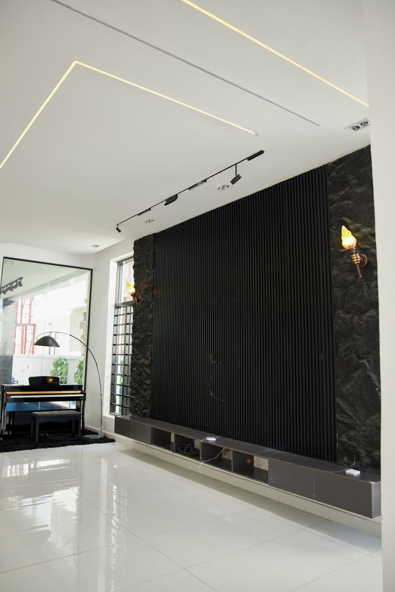 Sleek modern interior with black accent wall, mcpeter on Pexels