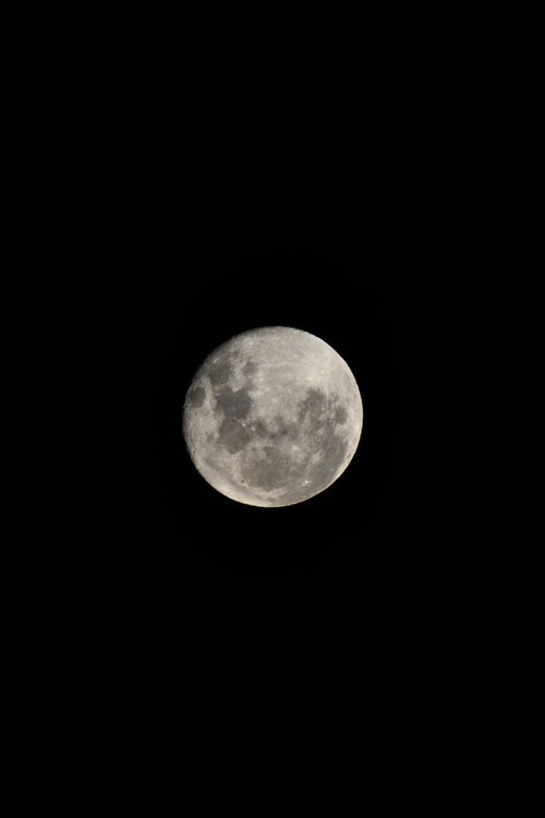 Free High-resolution image of the full moon against a clear black night sky. Stock Photo