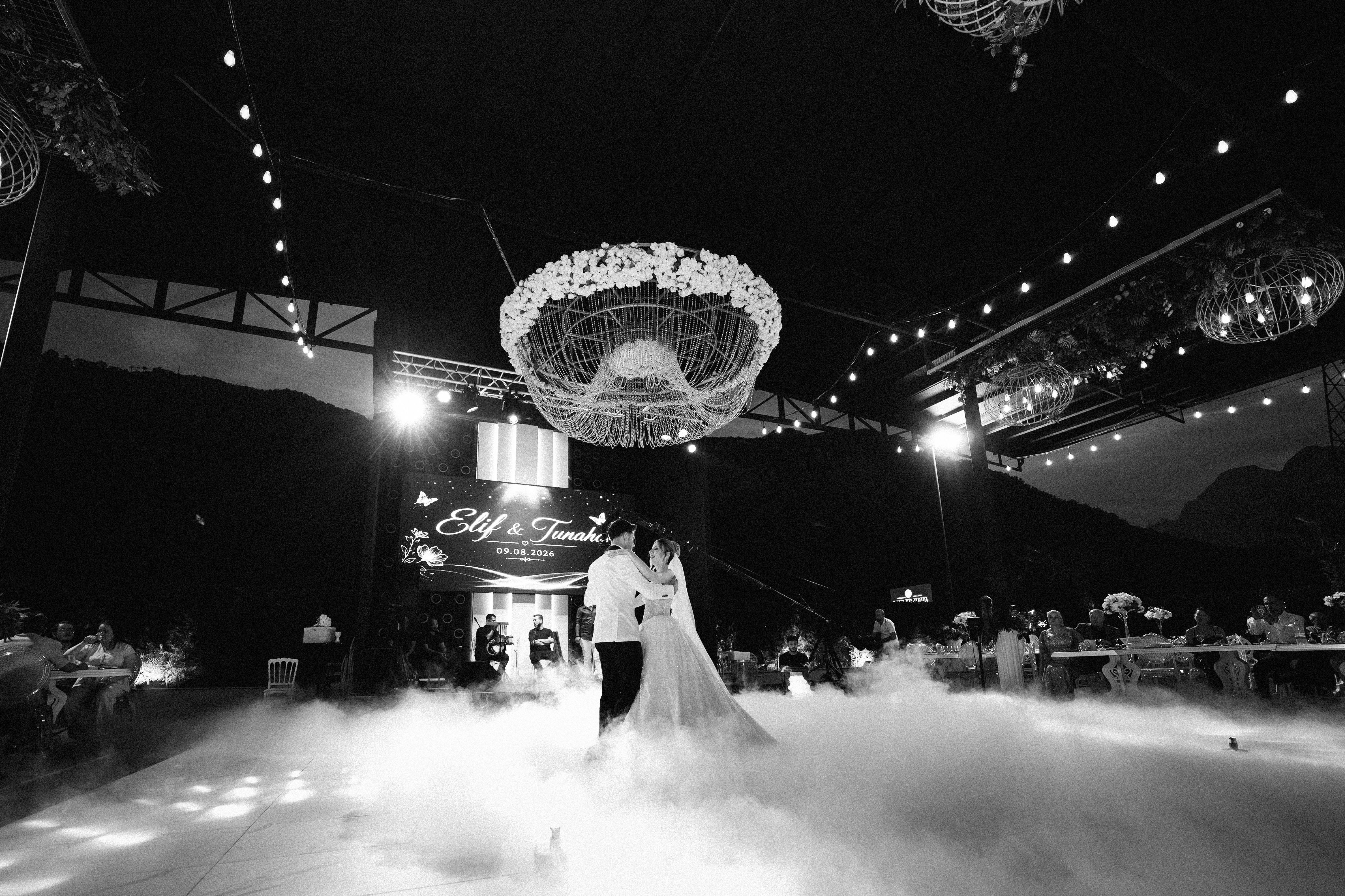 Elegant wedding dance under chandeliers in Antalya, Türkiye.