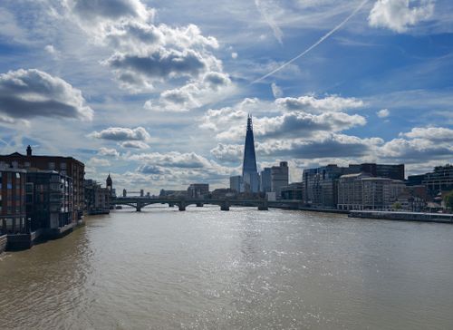 Free Scenic view of The Shard and River Thames with dramatic clouds in London. Stock Photo