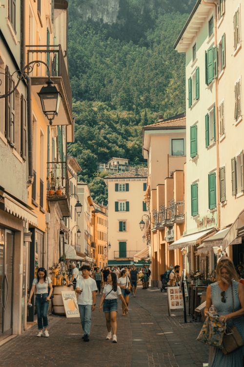 Free Bustling Italian street scene with people and classic architecture in summer. Stock Photo