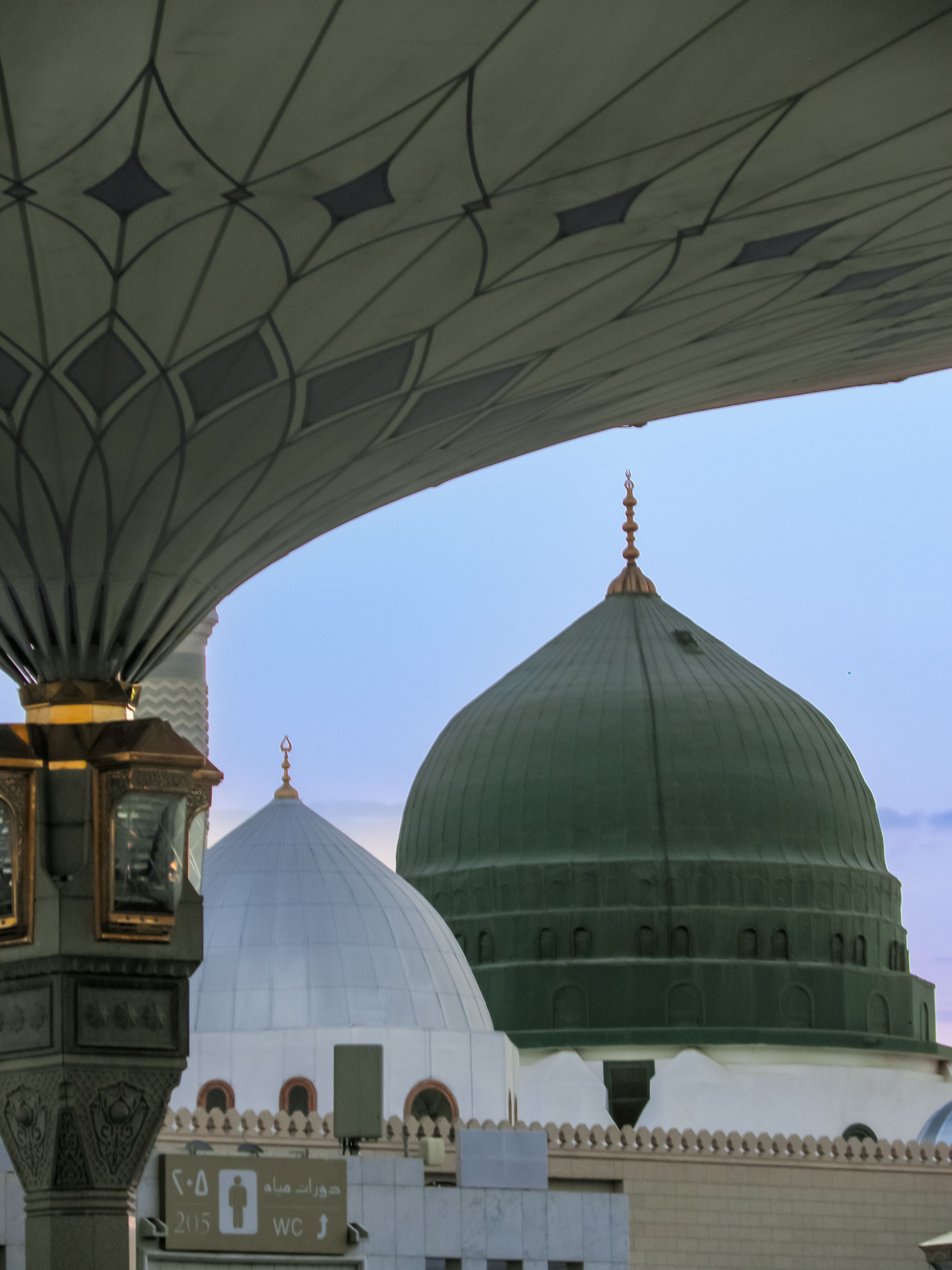 Beautiful view of the Prophet's Mosque dome at twilight in Medina, Saudi Arabia.