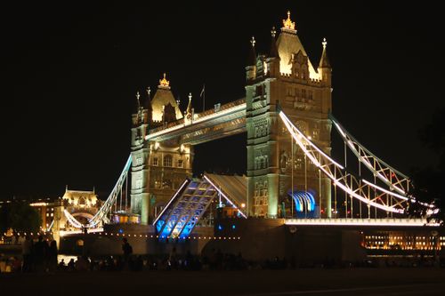 Free Beautiful nighttime view of the iconic Tower Bridge in London, illuminated against the dark sky. Stock Photo