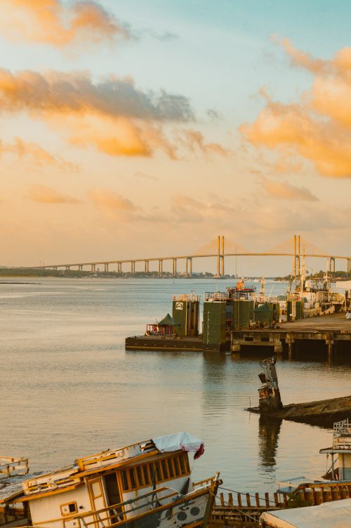 Free A scenic view of Newton Navarro Bridge over Natal Harbor, captured at sunset in Brazil. Stock Photo