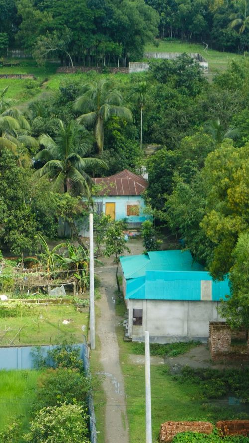 Free Aerial view of a vibrant village with greenery in Mymensingh, Bangladesh. Stock Photo
