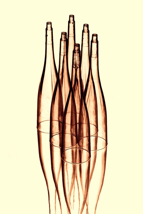 Free Creative image of transparent glass bottles in an artistic arrangement with reflective effects. Stock Photo