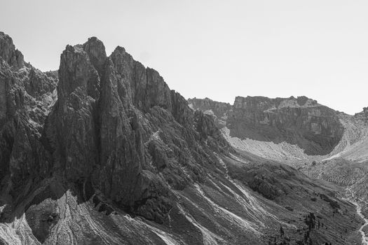 Stunning black and white photo capturing the rugged peaks of the Dolomites in Veneto, Italy.