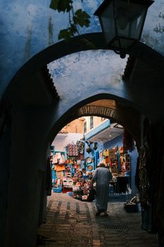 Explore the colorful alleys of Chefchaouen, Morocco, with its iconic blue-washed buildings and bustling market.