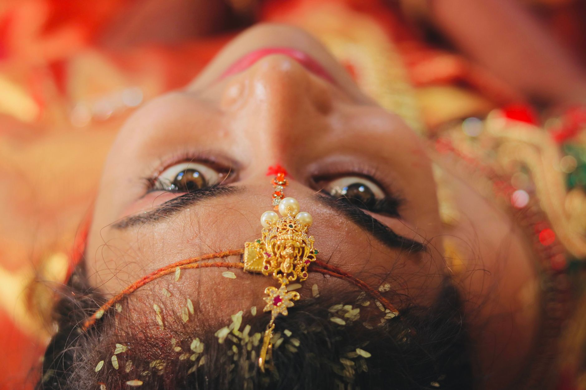 Standar Pelayanan Profesional dalam Menyediakan Paket Wedding Impian Anda 4 Close-up of a bride with intricate gold jewelry, capturing cultural elegance and beauty.