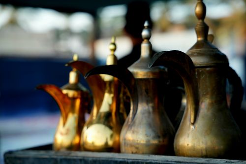 Free Close-up of traditional brass coffee pots in Karbala, symbolizing Middle Eastern hospitality. Stock Photo