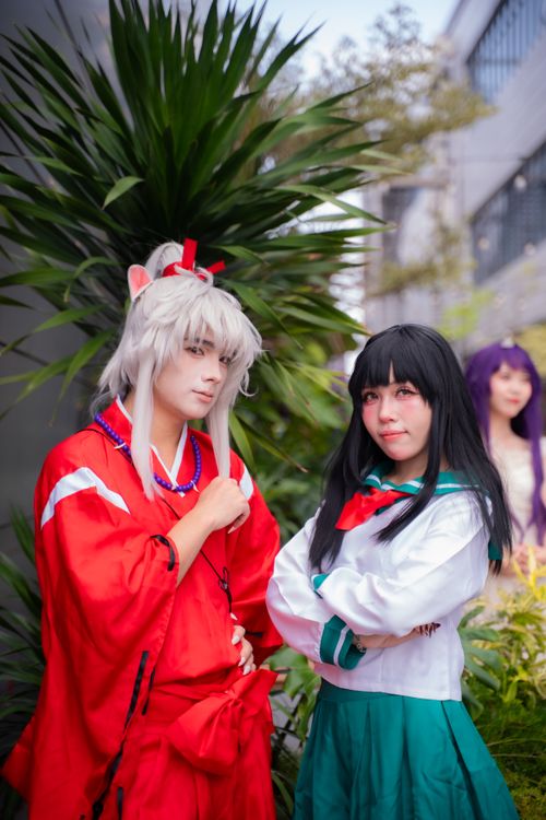 Free Two cosplayers in anime costumes pose outdoors at a themed event. Stock Photo