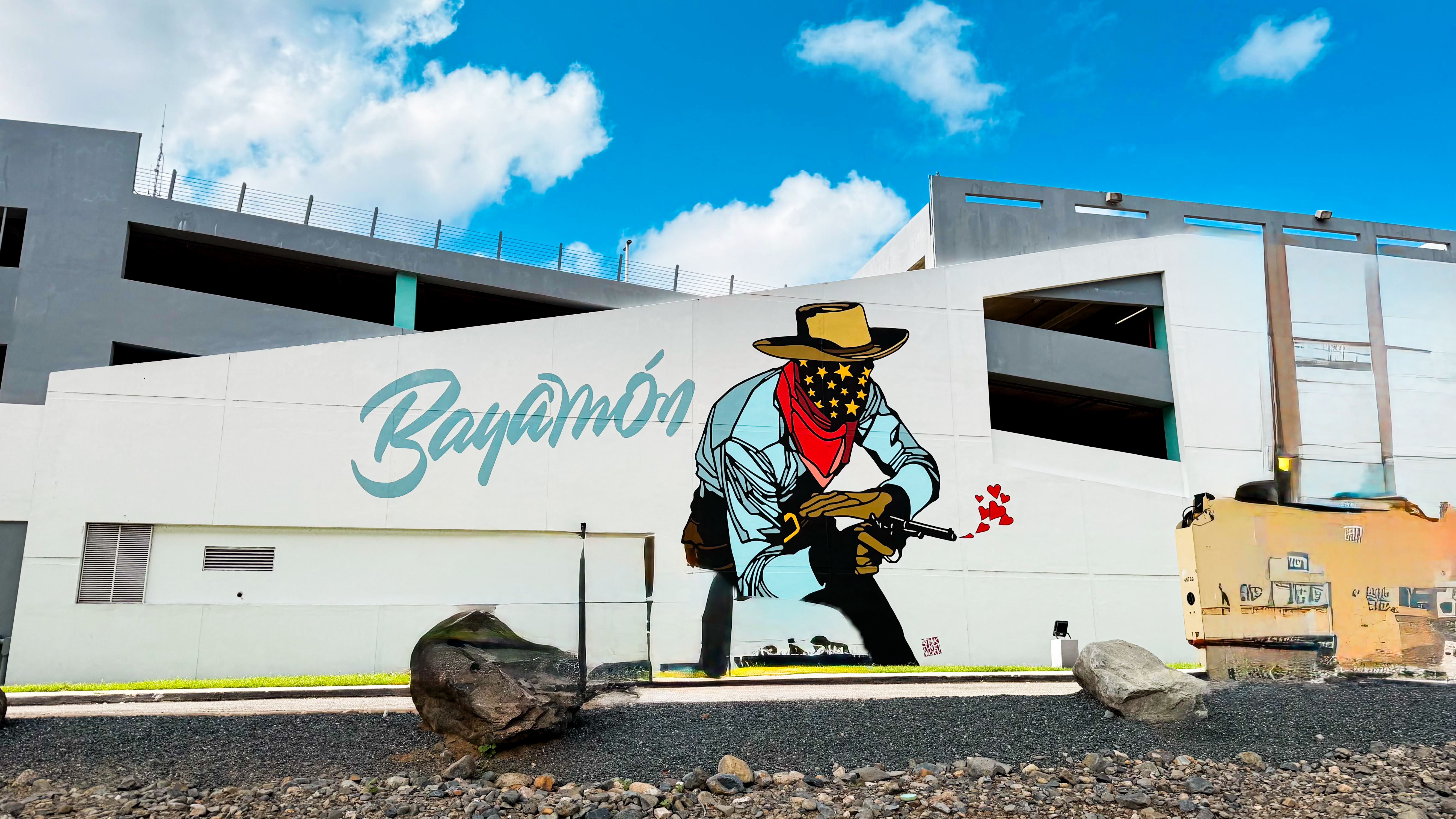 Vibrant street art mural on a wall in Bayamón, Puerto Rico depicting a cowboy.