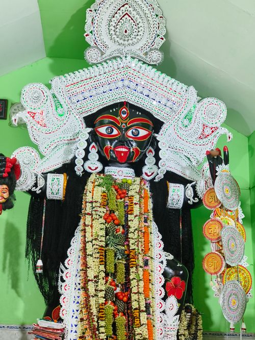 Free Colorful and ornate Kali idol adorned with flowers and garlands in Bhogpur, India. Stock Photo