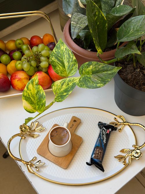 Free Luxurious coffee setup with plants and fresh fruit in Bordj El Bahri, Algeria. Stock Photo