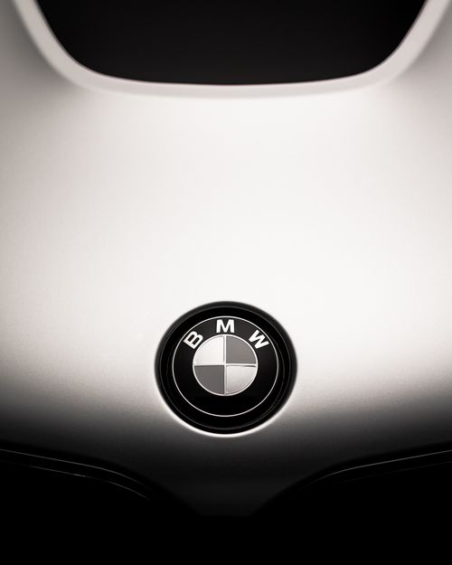 Free Detailed close-up of a car emblem on a sleek vehicle hood. Stock Photo