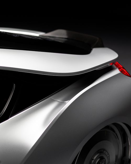 Free Close-up of an elegant car design showcasing sleek curves and modern aesthetics. Stock Photo