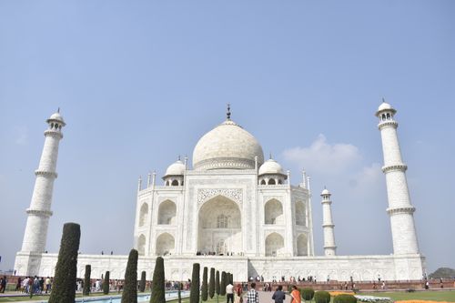 Free Stunning view of the Taj Mahal showcasing its intricate marble architecture and symmetry. Stock Photo