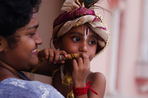 Free A touching moment between mother and child in vibrant Indian traditional dress. Stock Photo