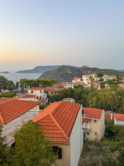 Free Breathtaking view of Skopelos town with red-roofed houses and the Aegean Sea during sunset. Stock Photo