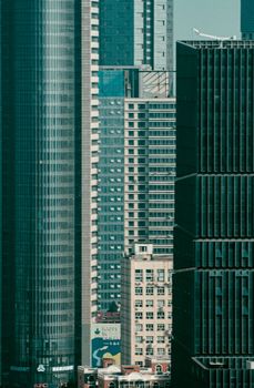 Tall skyscrapers in a modern city setting, daytime view.