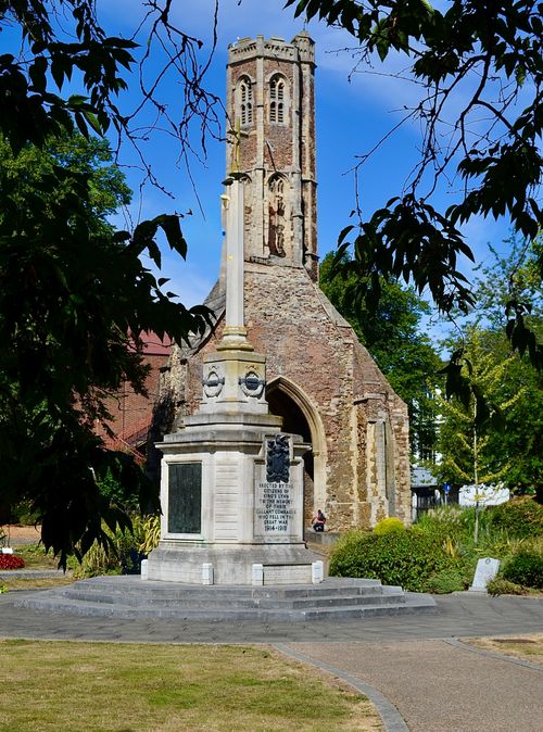 Free View of historic church ruins and a memorial monument surrounded by greenery. Stock Photo